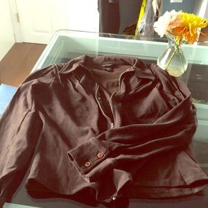 Brown zip front shirt.